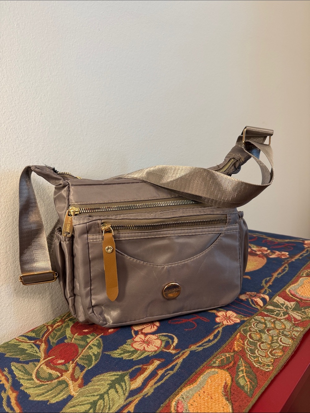 Compact Taupe Crossbody Bag with Gold Hardware